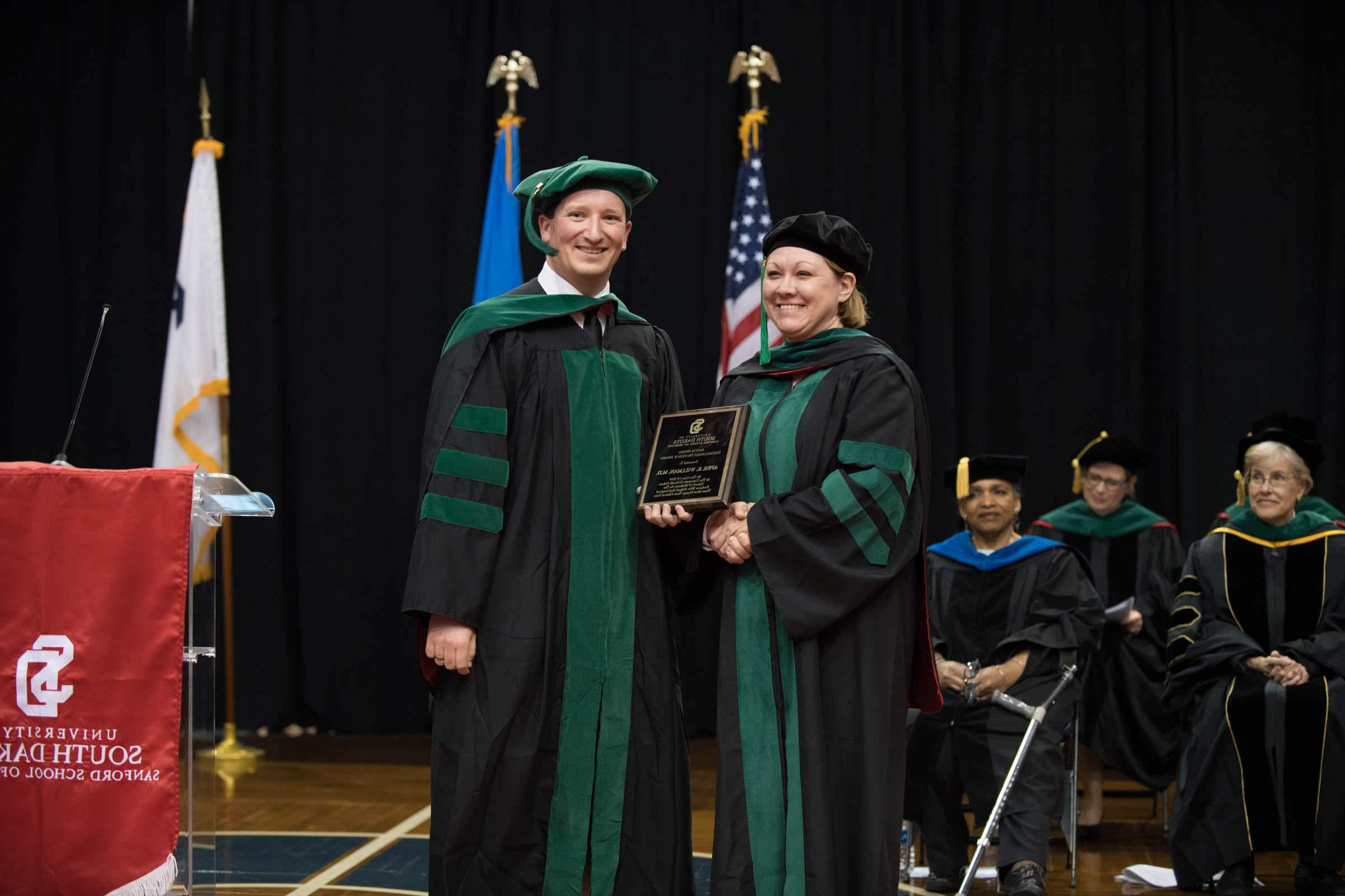 Dr. April Willman being presented an award by the University of South Dakota Sanford School of Medicine.